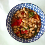 bowl of easy soup with white beans and greens